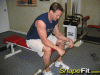 seated-palms-down-barbell-wrist-curls.gif